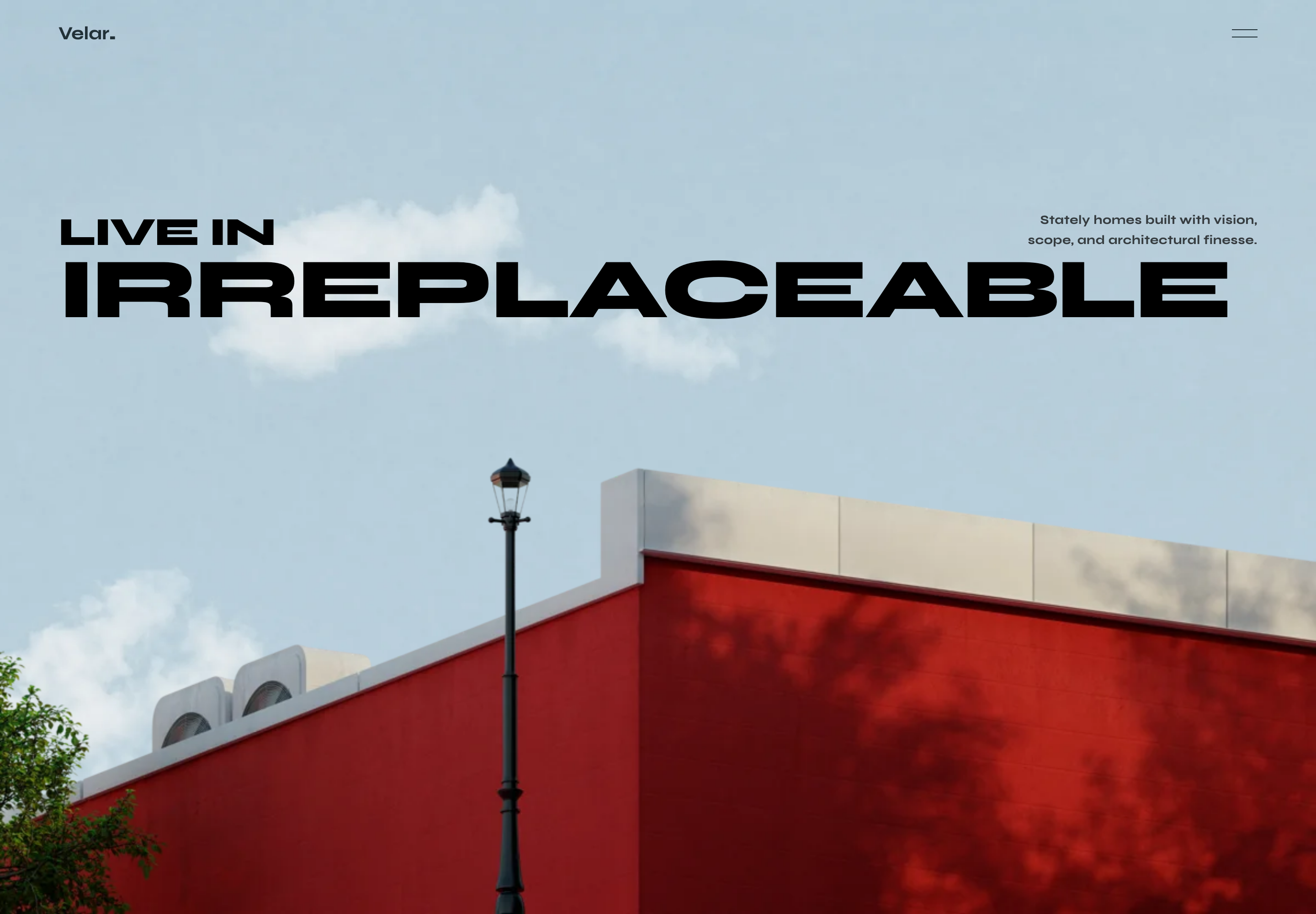 Velar luxury real-estate website after its native loading sequence, with oversized Irreplaceable typography, cloudy sky background, and the supplied architectural cutout.